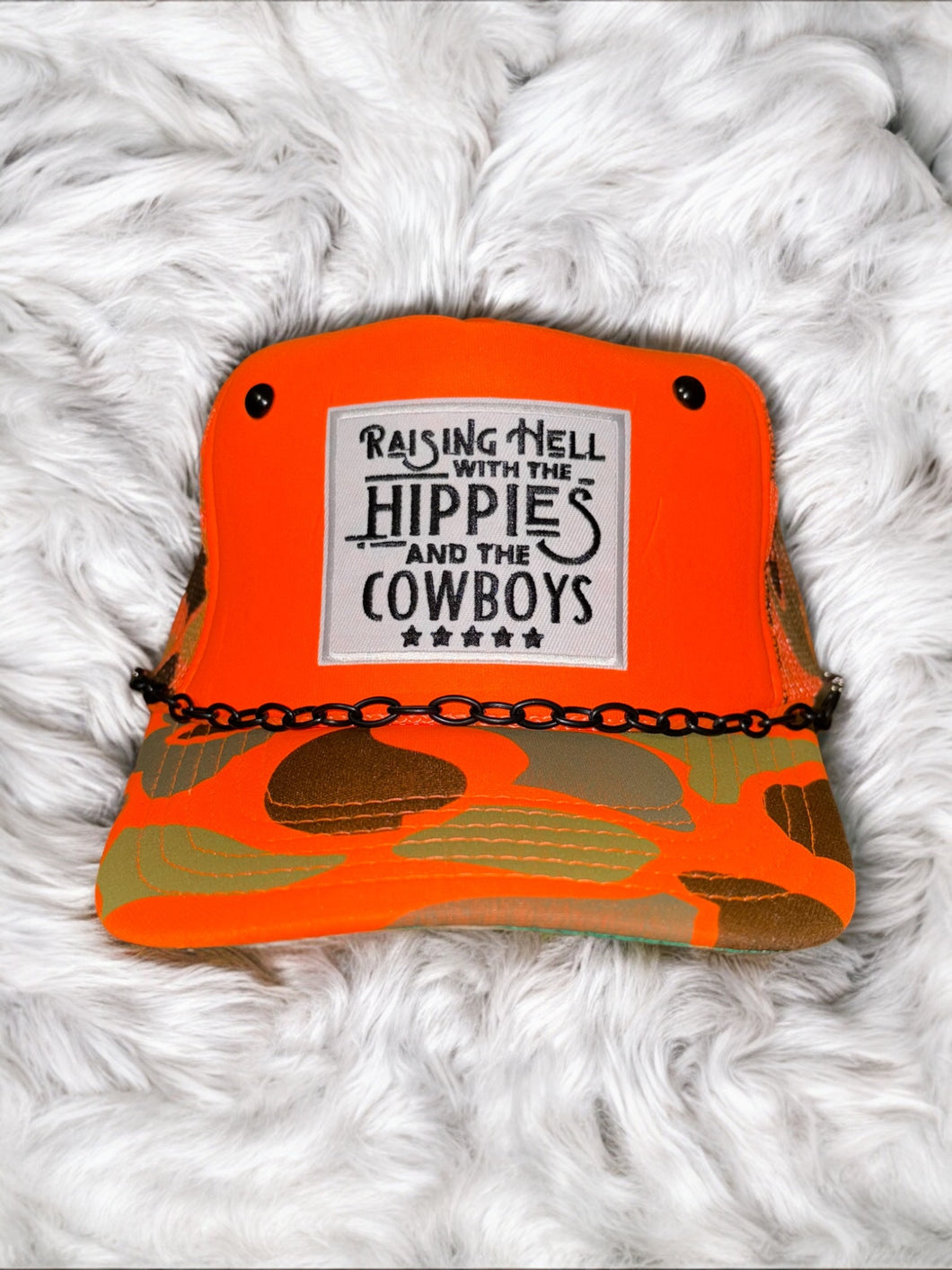 Raisin Hell: Orange Camo Trucker
